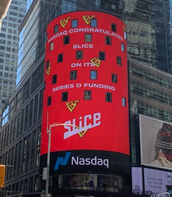 Slice’s Series D funding announcement displayed on a Nasdaq billboard in Times Square